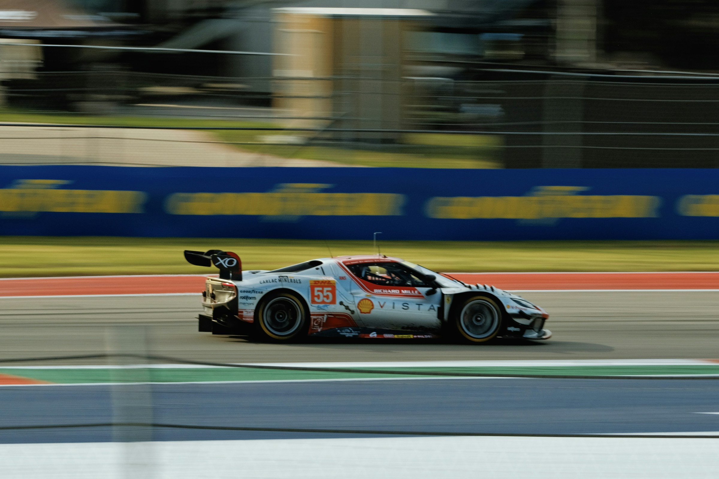 A racing car at speed on a circuit